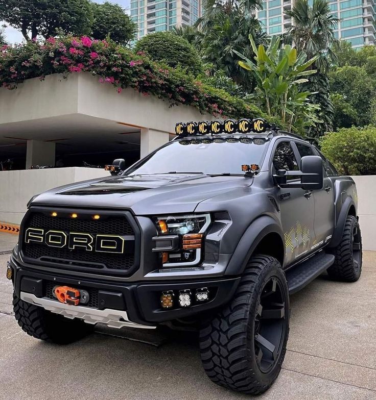 Black 2018 Ford Ranger pickup truck parked on a Kenyan highway with mountains in the distance